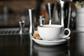 Cup of coffee on bar counter