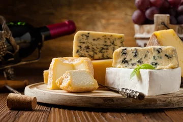 Rolgordijnen Mix cheese on wooden board. © gkrphoto