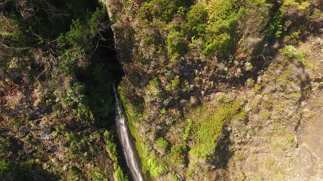 aerial view of waterfall and ocean in Madeira island
