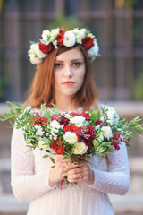 Beautiful bride outdoors portrait with flowers