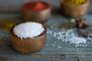 spices. Herbs. Curry, salt, pepper Saffron, turmeric, tandori masala and other on a wooden rustic background.Large collection of different spices and herbs.