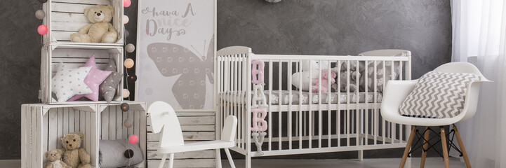 Obraz na płótnie Canvas Cosy baby girl's room in pastel colours