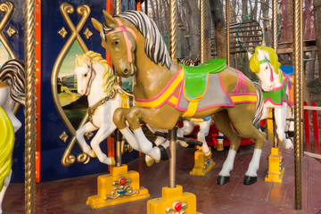 Fototapeta na wymiar carousel ride with horses