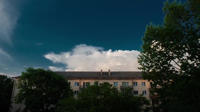 Towering Cumulus Cloud Billows Time Lapse Above the house