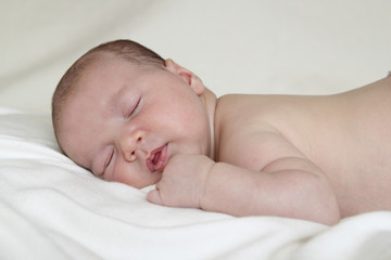 newborn sleeping relaxed