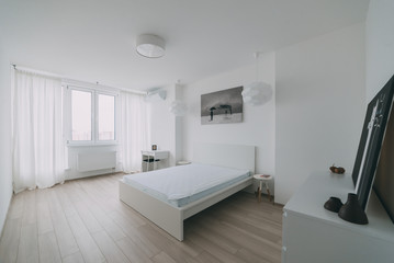 Fototapeta na wymiar Light interior with flooring in a modern apartment