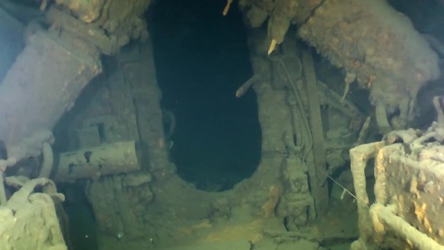 Swimming to the hatch between the compartments of the sunken submarine.
