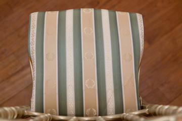 Stripped seat with beg, white and green colors