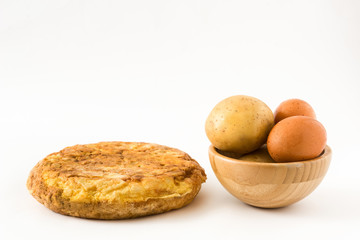 Traditional spanish omelette with potatoes and eggs isolated on white background

