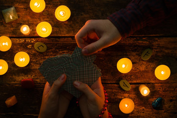 man chooses tarot card on the session at the fortuneteller