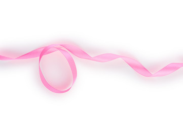 Pink satin ribbon isolated on white background. Top view. Flat lay.