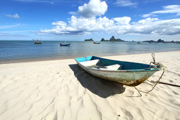 boat on the beach , blue sky and sea for background