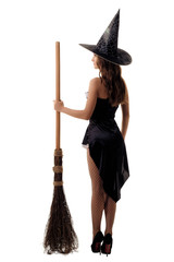 young woman in a witch costume posing in studio