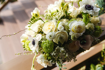 Delicate bouquet made of white roses, pionies and ranunculus