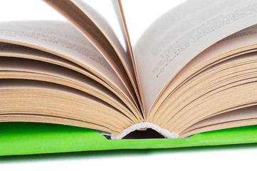 One green open book. on white, isolated fone.Macro. Close up.