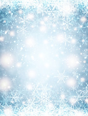 Blue winter background with snowflakes.
