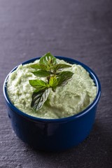 Small blue bowl with wasabi dip