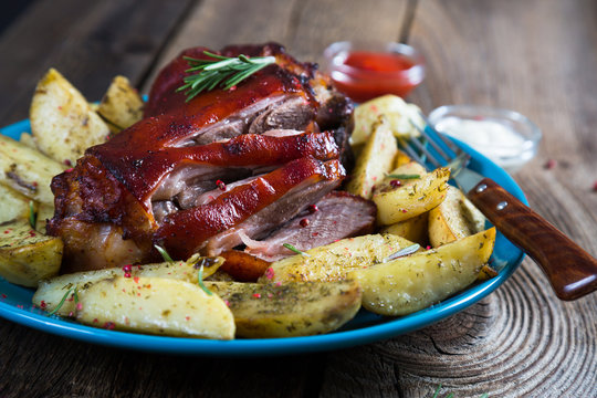 Pork knuckle with baked potatoes