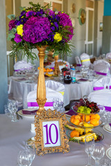 Floral arrangement and gold frame with a number of the decorated