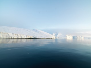 huge icebergs are on the arctic ocean in Greenland