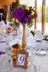 Floral arrangement and gold frame with a number of the decorated