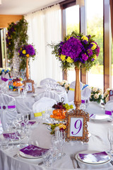 Floral arrangement and gold frame with a number of the decorated
