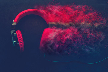 Disintegration effect photo manipulation applied to red headphones