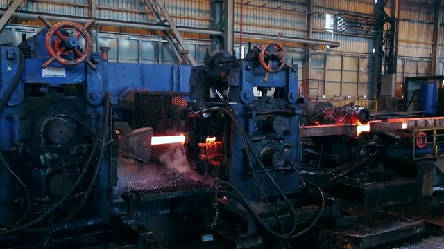 Ironworks plant. Burning Hot Billet moving through Machines