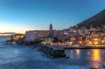 Fototapeta na wymiar Night lights at the seaside village with colorful houses/Genoa/Nervi/Italy