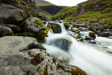 Waterfall. Water running over rocks. Iceland.