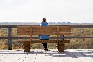 Girl sitting on a bench