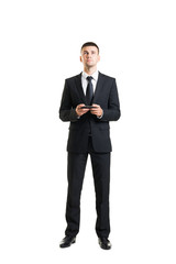 Young and confident business man with a telephone