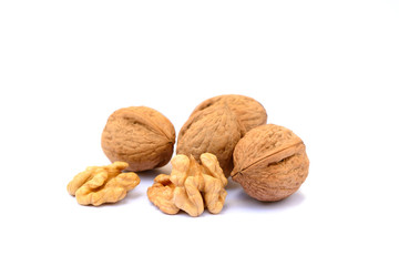 Pile of walnuts in shell isolated with white background