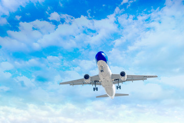 Travel by air transport, Passenger airplane in the clouds.