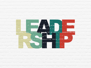 Business concept: Leadership on wall background