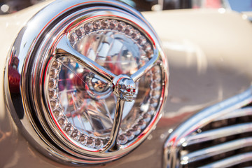 Part of a old vintage car with headlamp