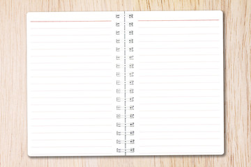 Open notebook paper with line on nature wood background for design with copy space for text or image.