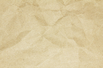 Recycled crumpled brown paper texture or paper background for design with copy space for text or image.