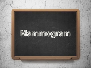 Health concept: Mammogram on chalkboard background
