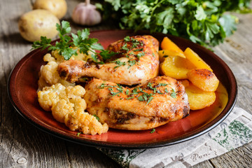 Roasted chicken legs with potato and cauliflower