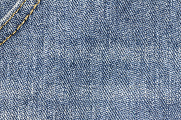 Naklejka premium Denim jeans texture or denim jeans background with seam. Old grunge vintage denim jeans. Stitched texture denim jeans background of jeans fashion design.