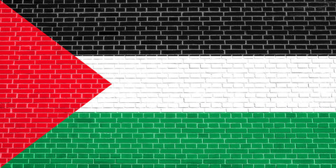 Flag of Palestine on brick wall texture background