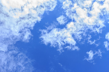 Fototapeta na wymiar Blue sky background with white clouds. The vast blue sky and clouds sky on sunny day. White fluffy clouds in the blue sky.