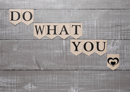 do what you love sign heart symbol on wood board