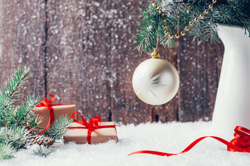 Composition with Christmas decorations in vase on dark wooden background