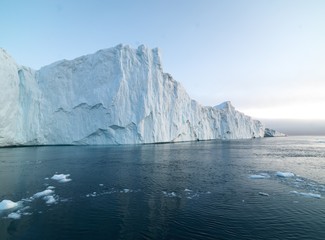 Obraz na płótnie Canvas Big icebergs are ont he arctic ocean in Greenland