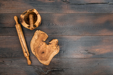 Kitchen utensils. Rolling pin, mortar and wooden board