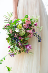 Beautiful wedding bouquet in the hands of the bride, bouquet of