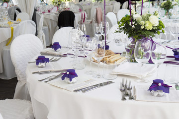 Restaurant with tables set for a wedding reception
