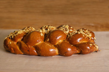 detail of christmas cake sprinkled with almonds on wooden backgr